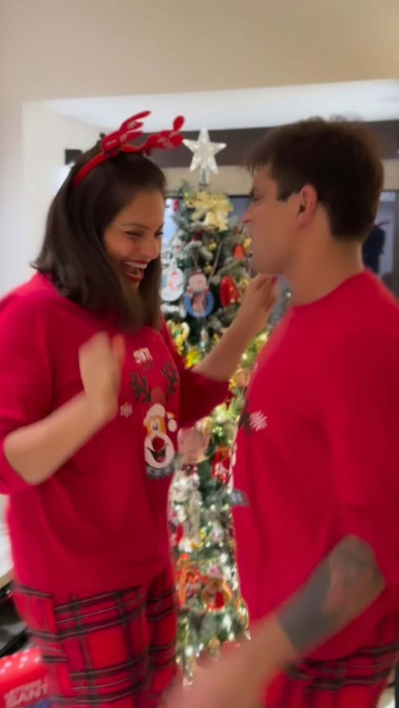 Bipasha Basu and Karan Singh Grover jump with joy as they celebrate Christmas, twinning in red and spreading festive cheer with their infectious smiles.