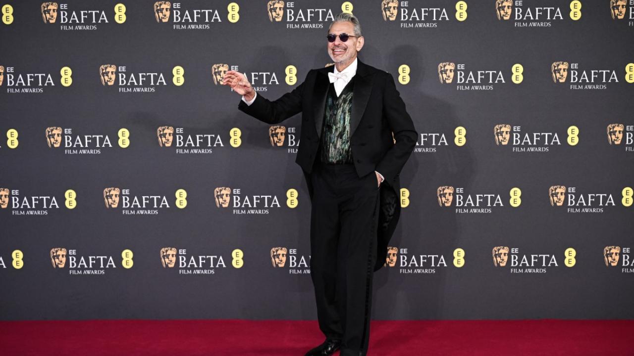 Jeff Goldblum opted for a feathered vest and round tinted sunglasses that stood out in his classic black-and-white look.