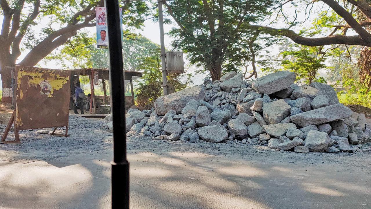 Debris from the previously laid cement concrete road still visible at the site