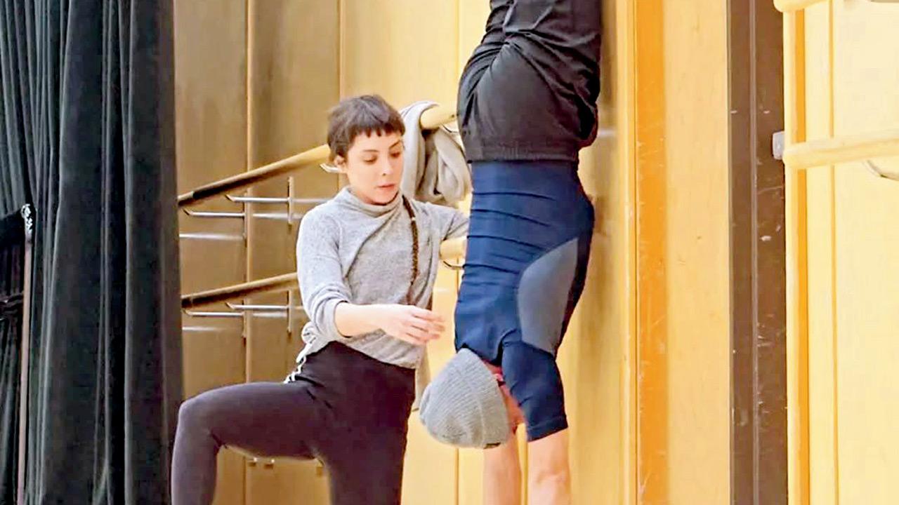 (Left) Ailyn Ramos corrects the posture of a student at a workshop in San Francisco. pic courtesy/INSTAGRAM