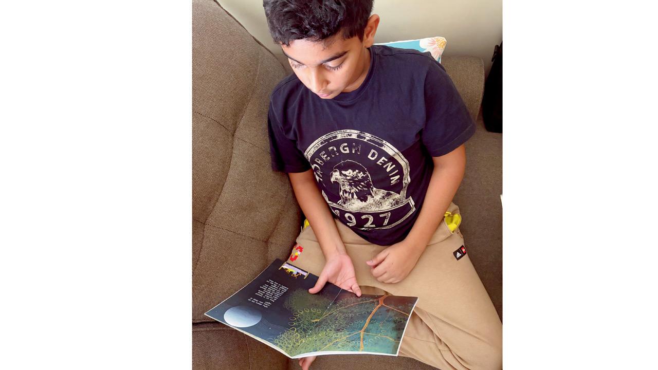 Ashaz Siddiqi reads about how trees act as air purifiers. PICS/NASRIN MODAK SIDDIQI