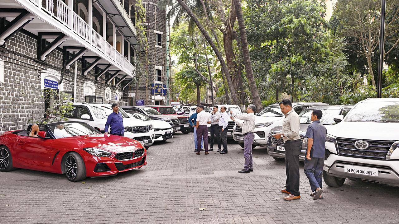 The vehicles seized include a BMW convertible. Pics/Ashish Raje