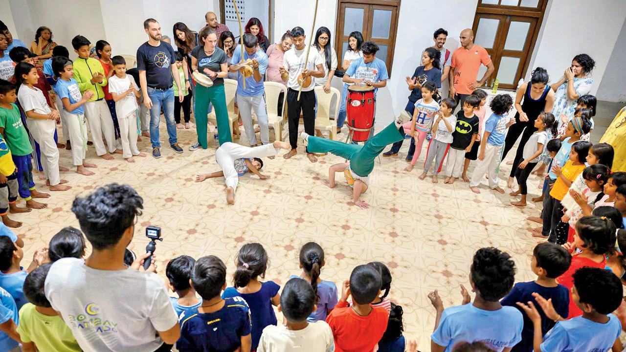 participants practice headstands during a previous workshop in Khar