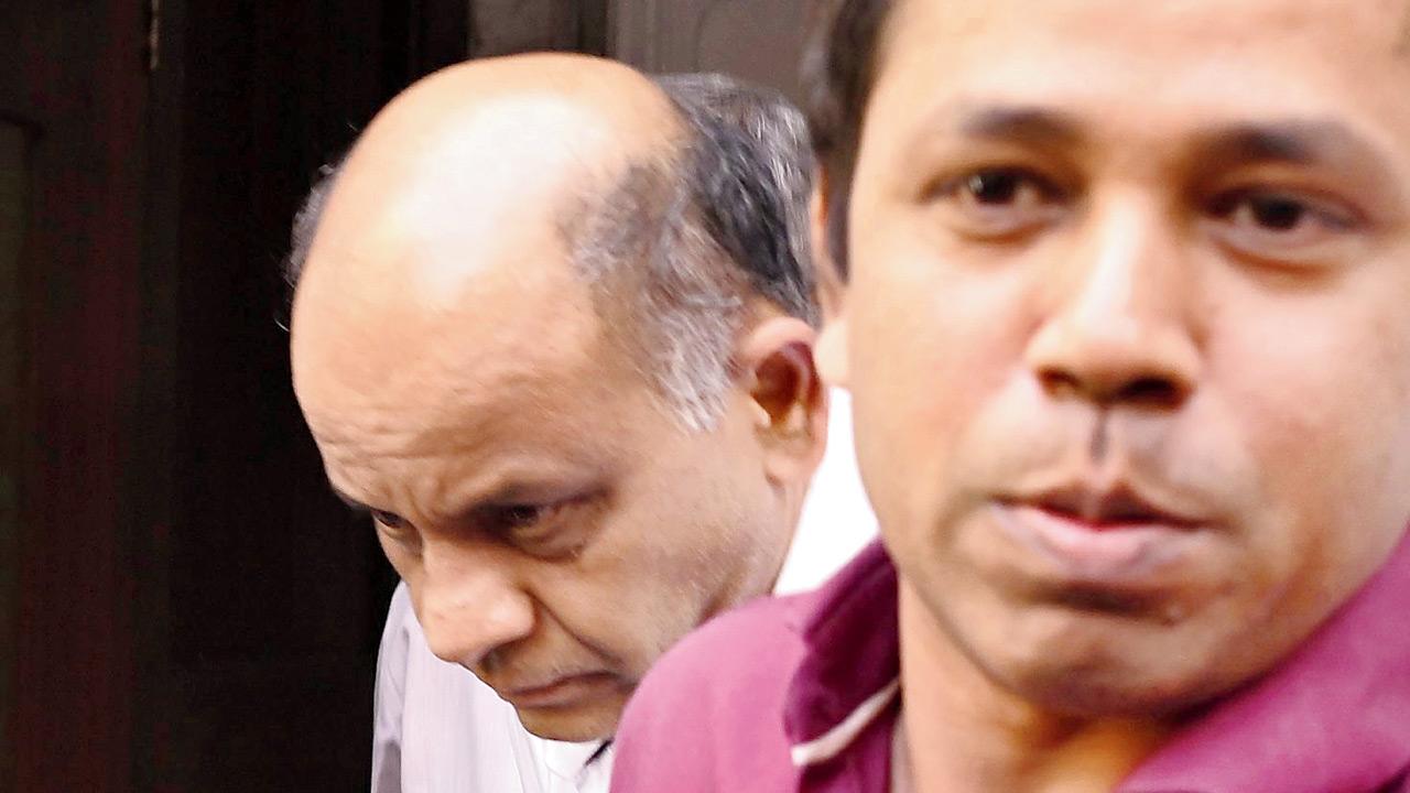 (Left) Hitesh Mehta, former general manager of the New India Co-operative Bank is produced in the Esplanade court on February 16. Pic/Ashish Raje