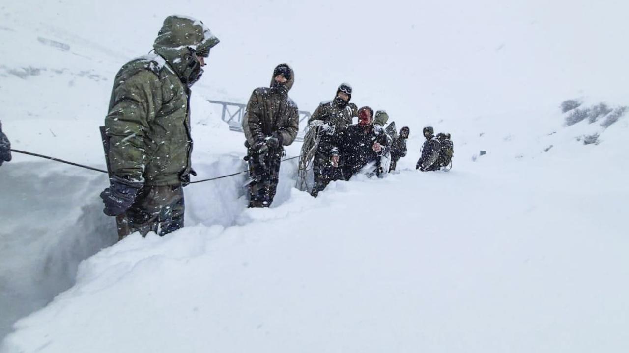 Multiple teams battled through tough terrain, heavy snow and icy temperatures through the day to reach the men