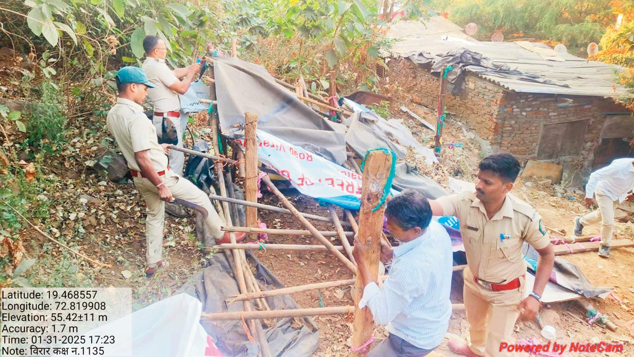 Forest department officials demolishing illegal structures