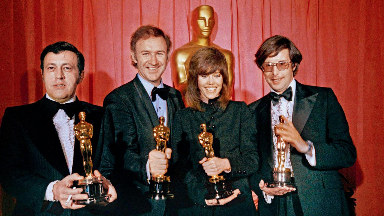 Gene Hackman (second from left) won Best Actor for his role in the 1971 film, The French Connection, produced by Philip D’Antoni (left); Jane Fonda and William Friedkin (right) with their awards. pics/AFP