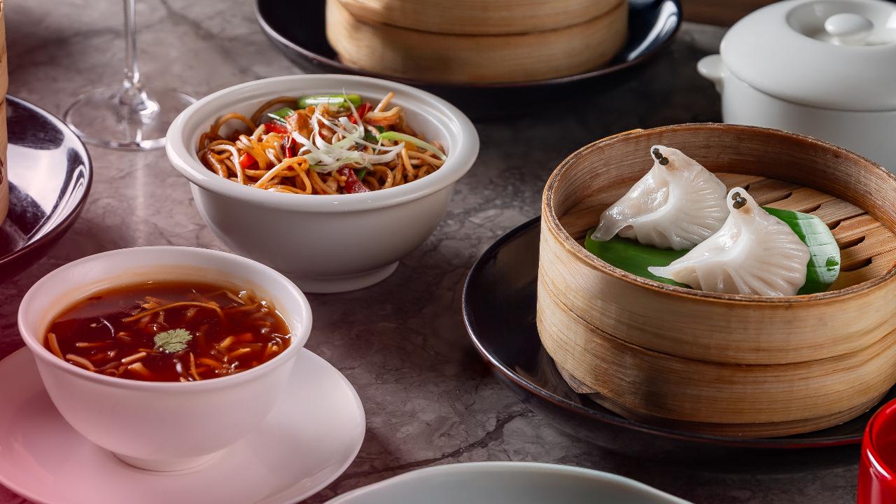 Five-course Asian menuHakkasan has launched its all-new Plum Blossom Menu — a five-course lunch menu to elevate your afternoon meals. The menu will be available at Hakkasan Bandra from March 1 to 8 from 12 noon to 3 pm. The menu includes soups but also vegetarian specials such as Carrot cake, Spicy jackfruit dumpling, Vegetable crystal dumpling, and Edamame truffle dumpling and Szechuan mabo tofu. On the other hand, the non-vegetarian menu has a wide array of dishes such as Har gau, spicy chicken or chicken and prawn dumpling, Crispy duck roll, Stir-fry chicken, Stir-fry lamb tenderloin and Steamed grouper. While you are enjoying the food, sip on some delicious cocktails like some citrusy Southside, Elderflower gin sour, Ling Ling wallbanger and Spice guava or the aromatic Bird’s tongue jasmine green tea. End your meal with Dark chocolate mousse and Apple and Vanilla crème brûlée.
Where: Hakkasan, Bandra West When: March 1 to 8Time: 12 noon to 3 pmCall: 083558 77777 for reservations