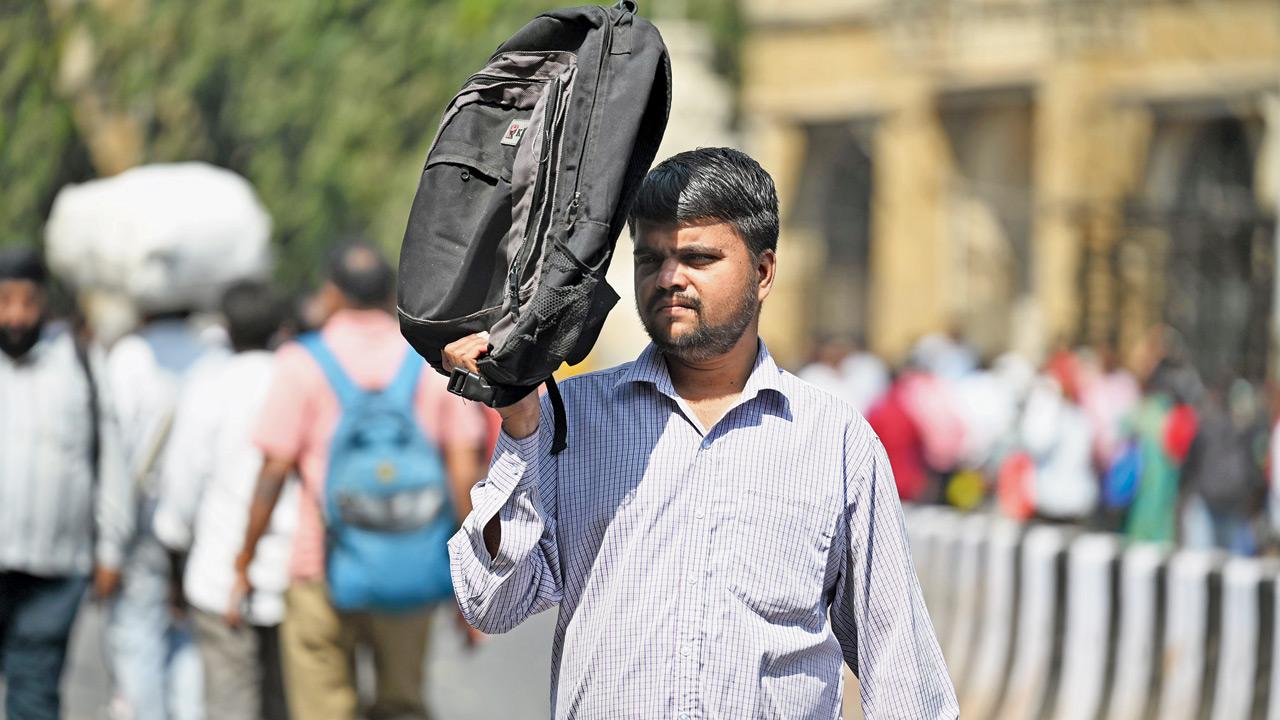 People shield themselves from the heat in Mumbai. Pic/Atul Kamble