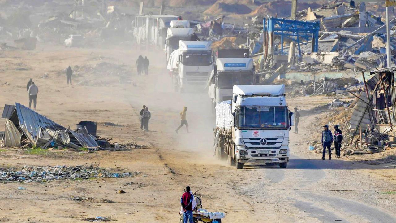 Egyptian trucks carrying humanitarian aid enter the Gaza Strip