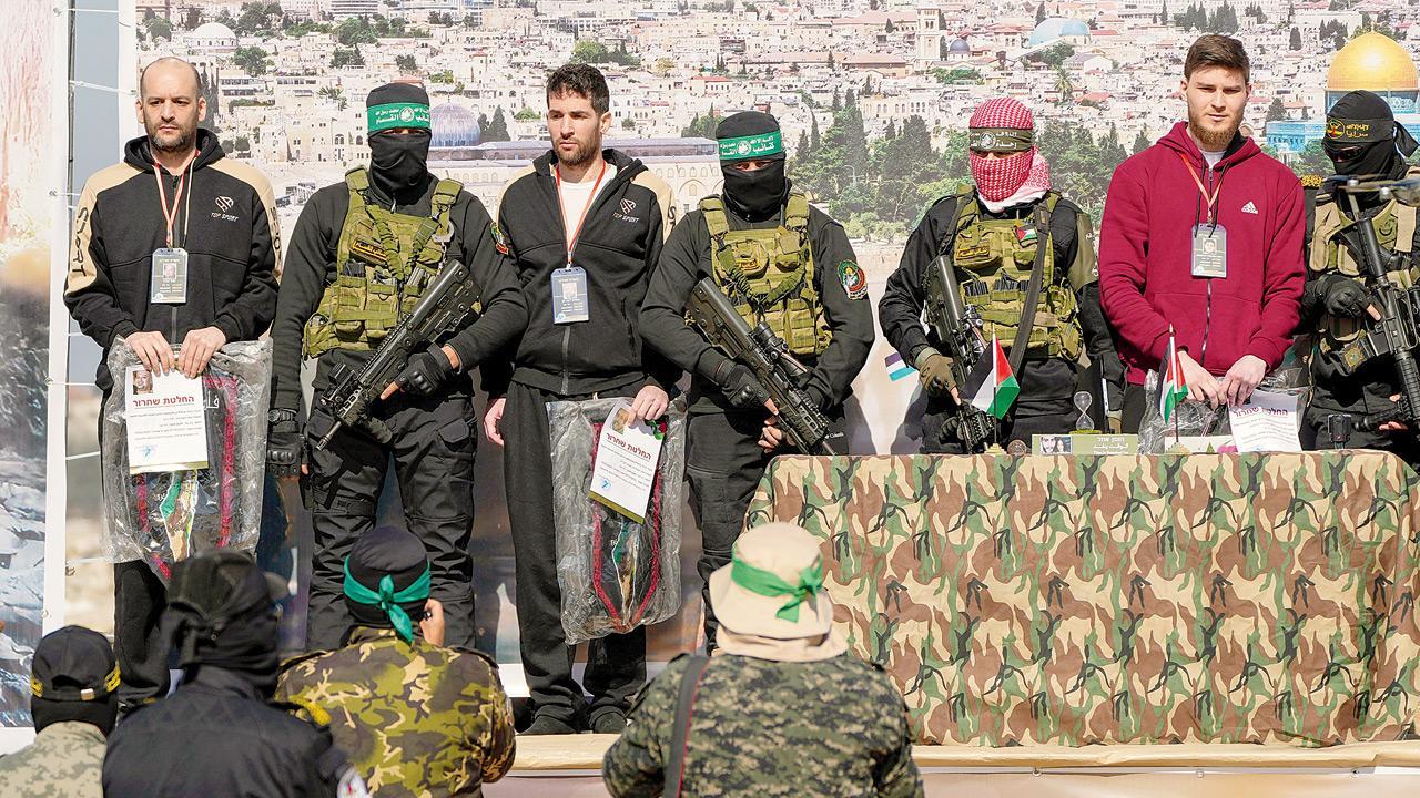 Hamas militants release 3 male Israeli hostages