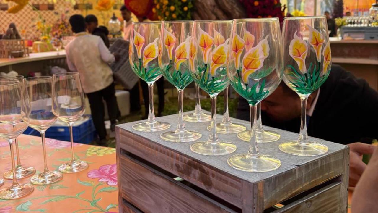 The hand-painted glasses by Family of Disabled adds to the beauty and aesthetics at the wedding