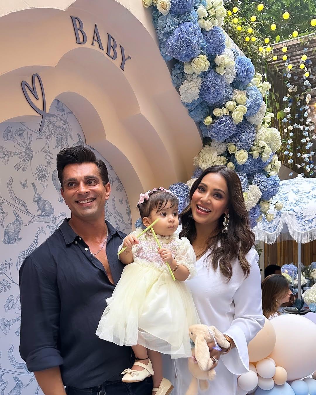 A man can be happiest only when he is with his lady love or his baby girl, and Karan's smile is proof of how he feels when he is with Bipasha and Devi