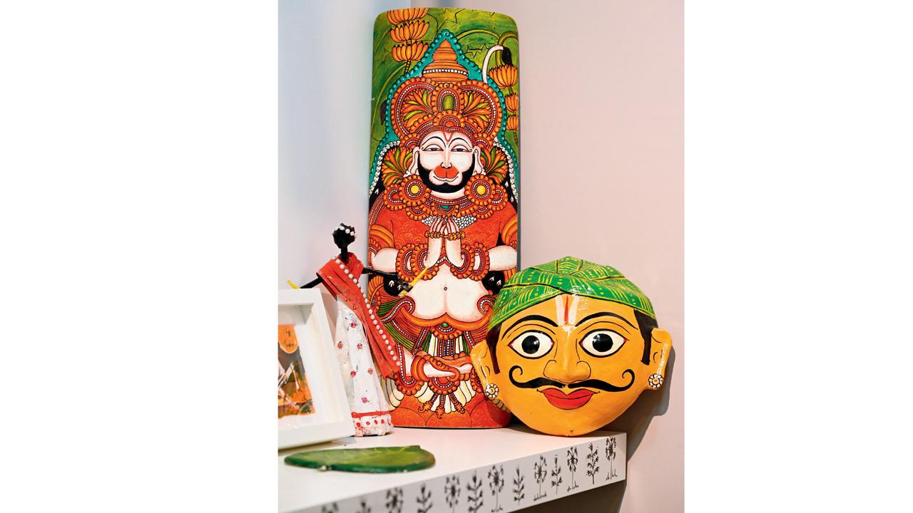 A Kerala mural fresco-style painting of Lord Hanuman; a Cheriyal-style mask