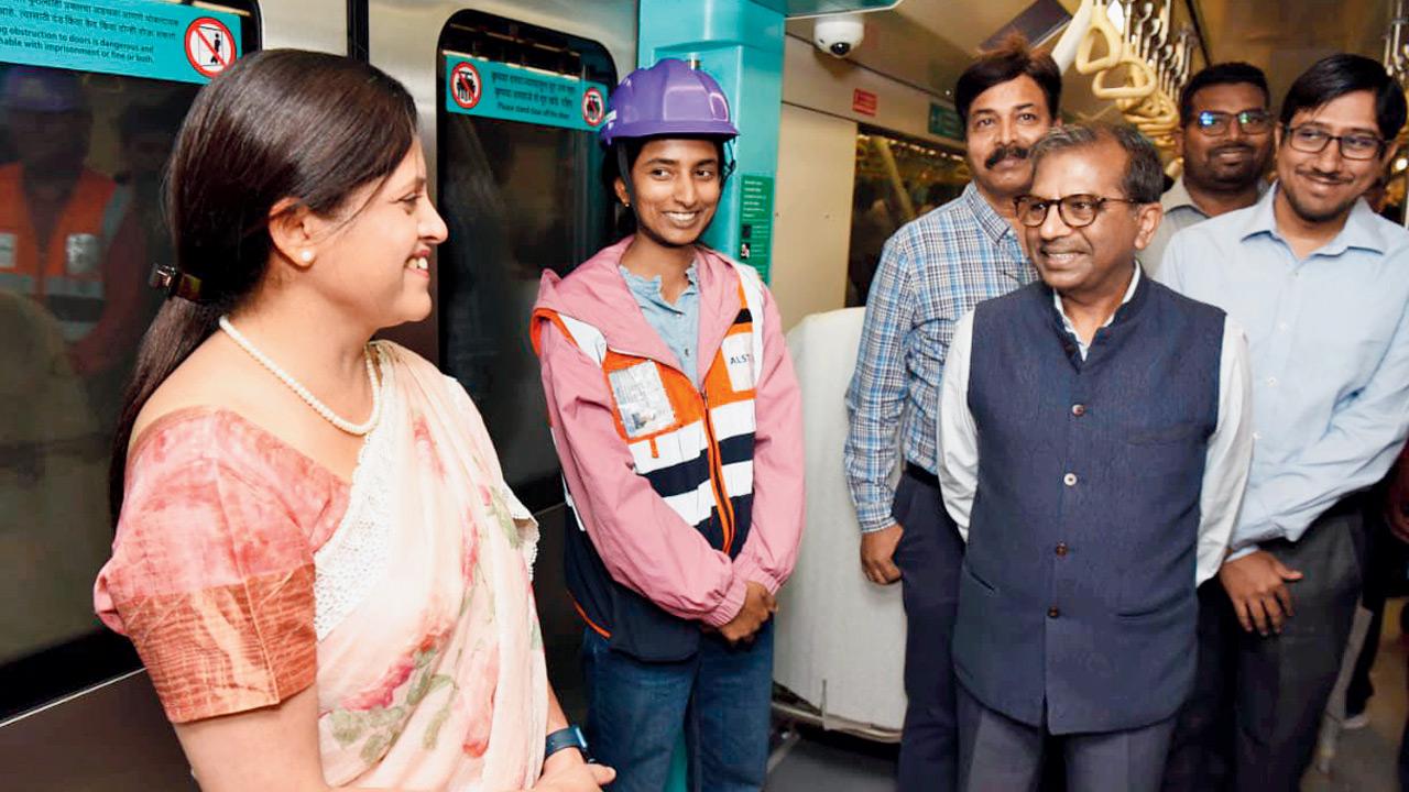 MMRC Managing Director Ashwini Bhide (left) and Director of Projects S K Gupta (in blue jacket) on board the Metro during its trial run