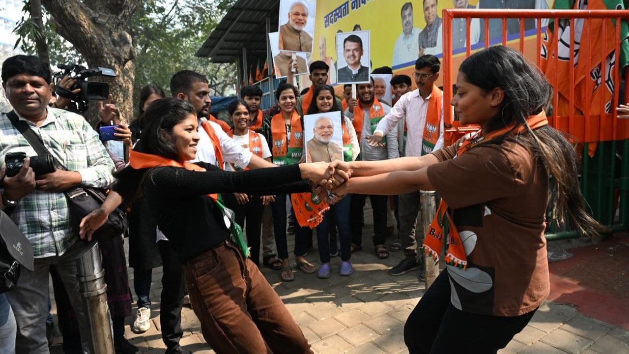 BJP workers were seen bursting firecrackers and singing at the party office