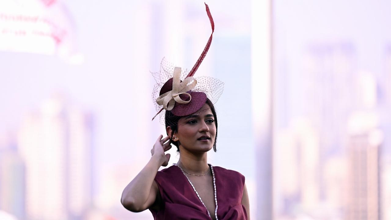 Beyond the gold and black, another attendee sported a maroon hat matching her outfit, while looking perfect for the occasion