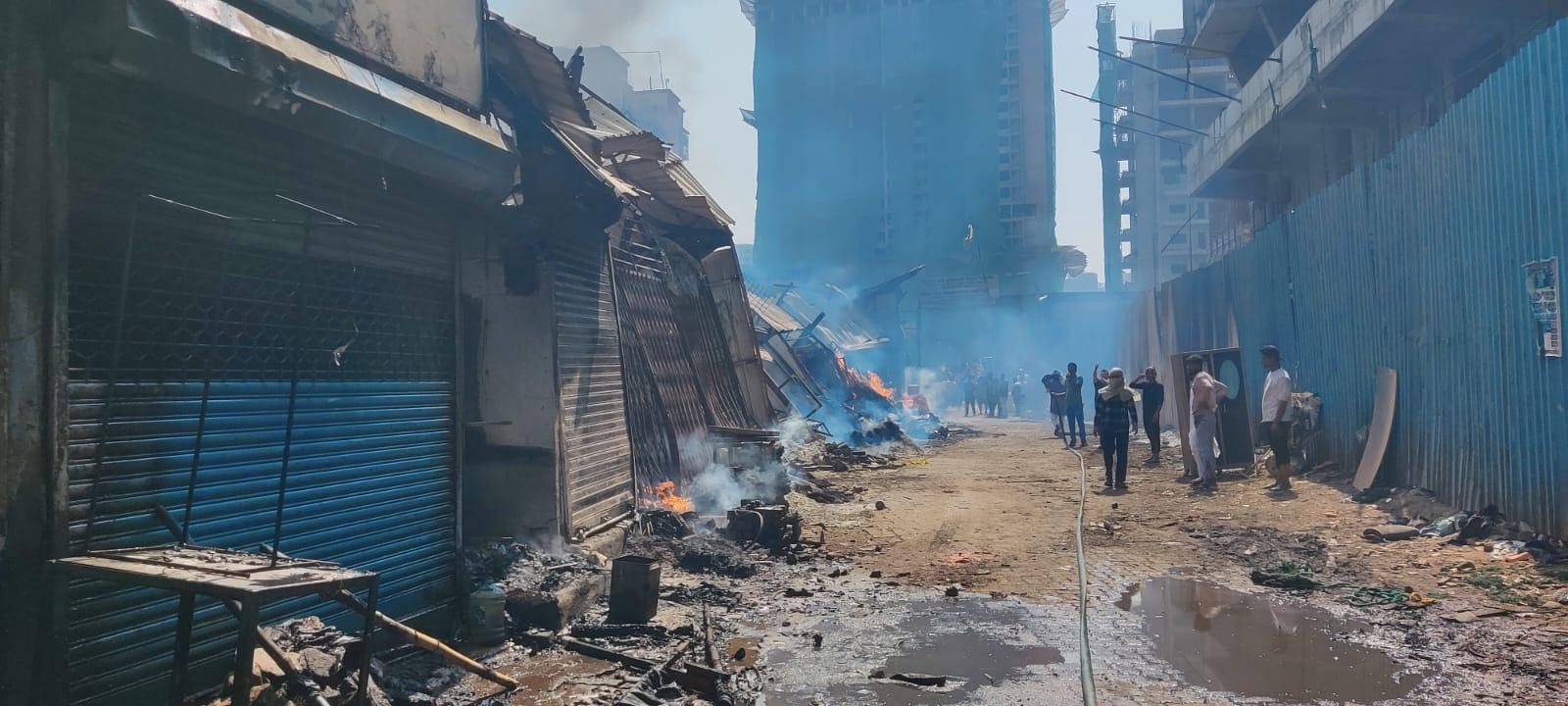 The fire erupted around 11:30 AM at a furniture godown and quickly spread to adjacent shops.