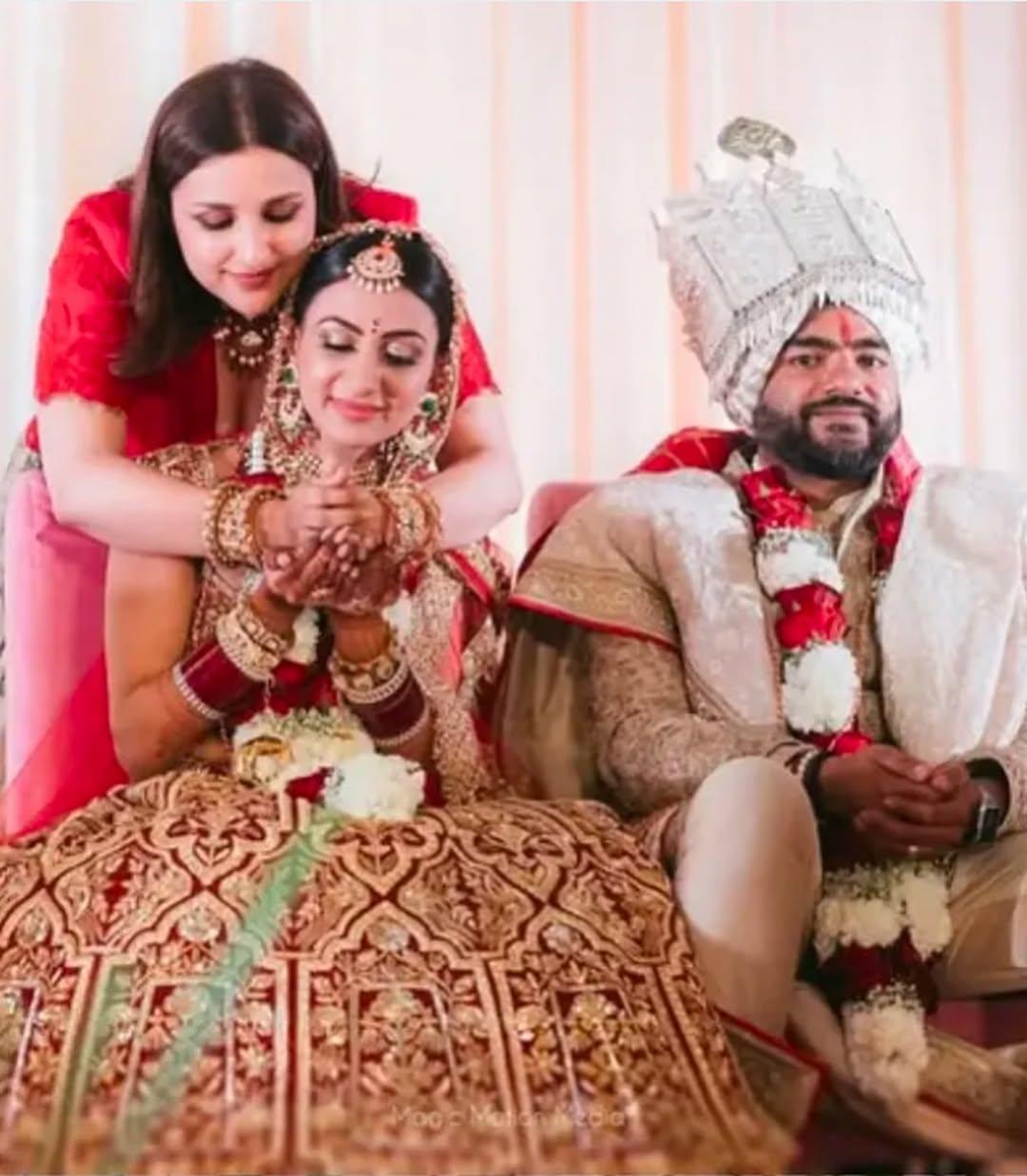 This snap has Parineeti performing a ritual as she welcomes Neelam into the family