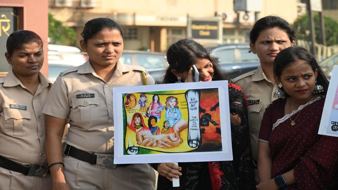The cops hold placards creating awareness in south Mumbai