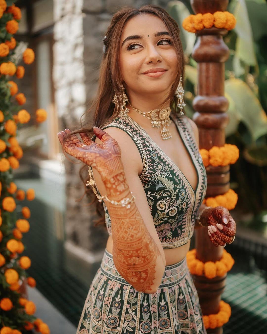 For her hair, Prajakta tied it in a half clutch and added flowers to elevate the look. The influencer made sure to keep her makeup minimal