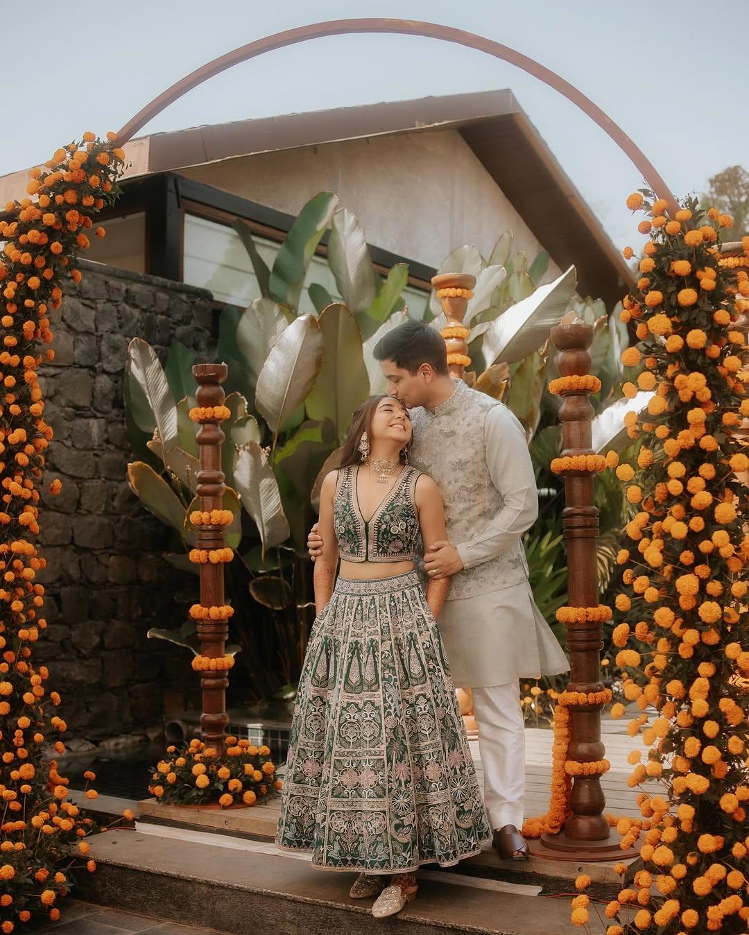 Prajakta gave classy bride vibes by pairing her outfit with stylish silver shimmery mojdis, while Vrishank wore brown chappals