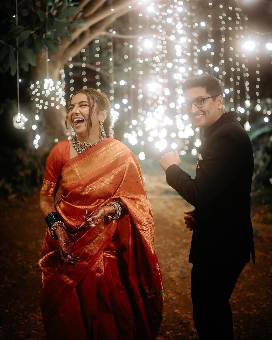 For the Sangeet ceremony, Prajakta wore a stunning orange saree, while her husband-to-be, Vrishank Khanal, complemented her in a black bandhgala