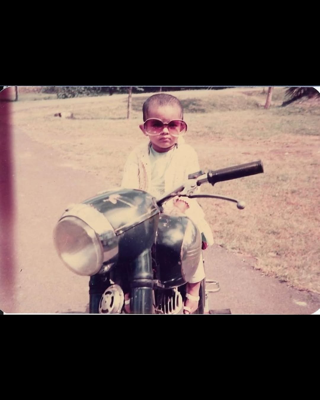 The first picture in the carousel has a young Priyanka seated on her dad’s bike while wearing her mom Madhu Chopra's sunglasses. The snap was from 1983