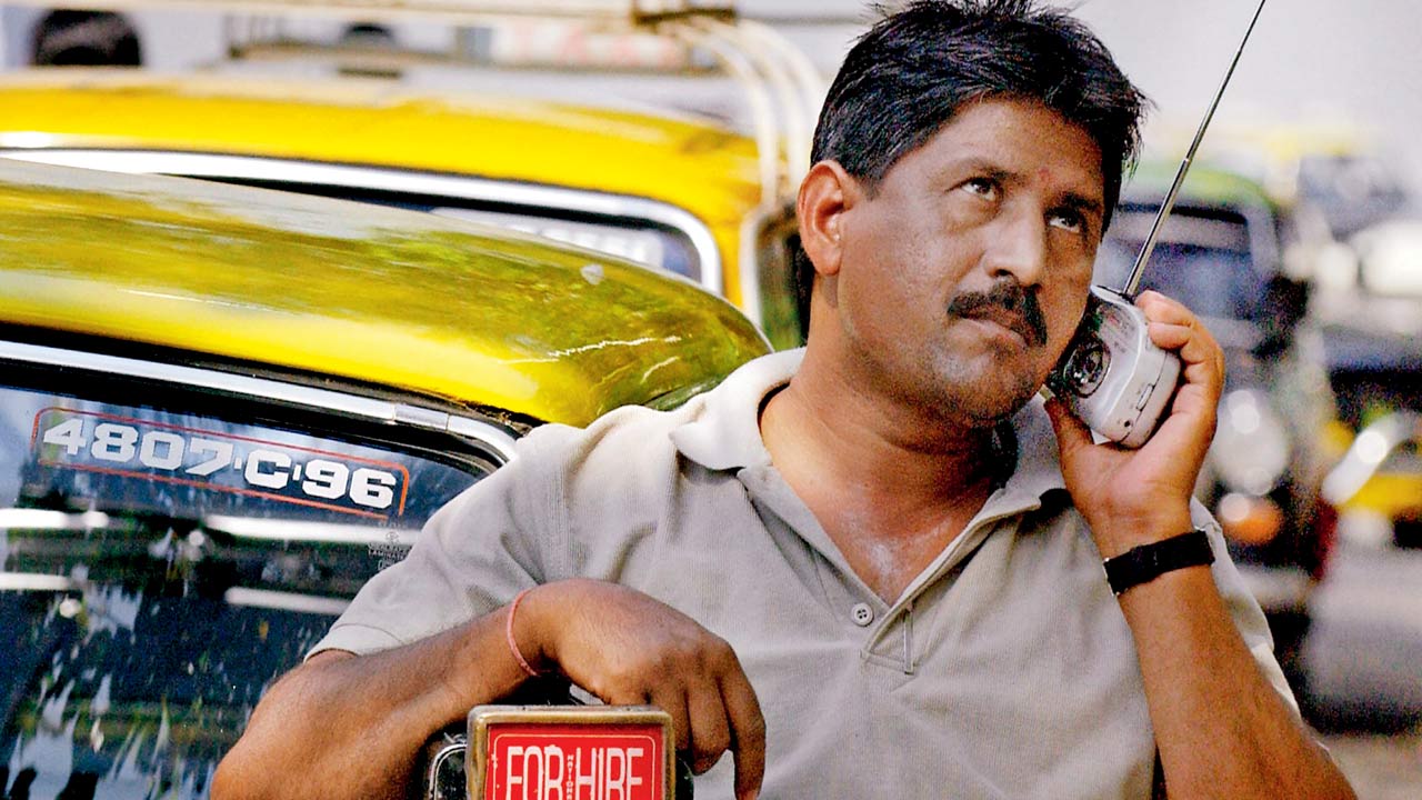 A taxi driver in Mumbai listens to the radio broadcast of the long-awaited revival cricket match between India and Pakistan on March 13, 2004. Pic/Getty Images