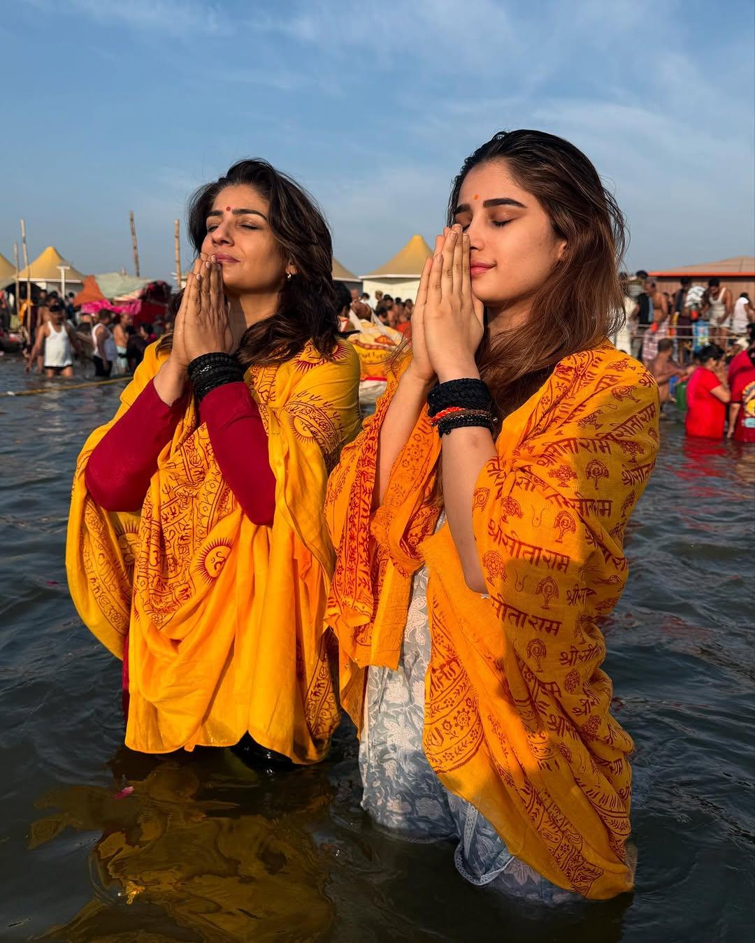 Rasha Thadani shared a series of pictures from her trip to Maha Kumbh with her mother. In this picture, the duo is seen standing in the middle of the holy river with folded hands