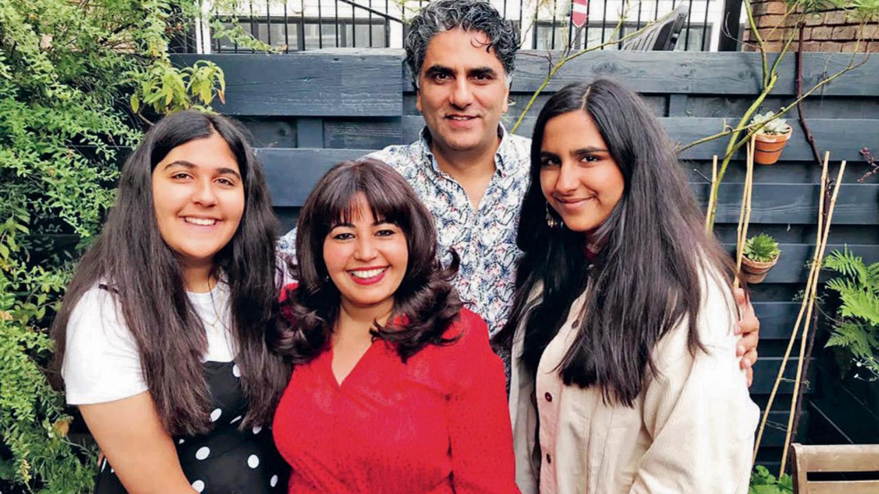 Romy Gill (red blouse) with daughters Reet and Neev as well as  huband Gundeep