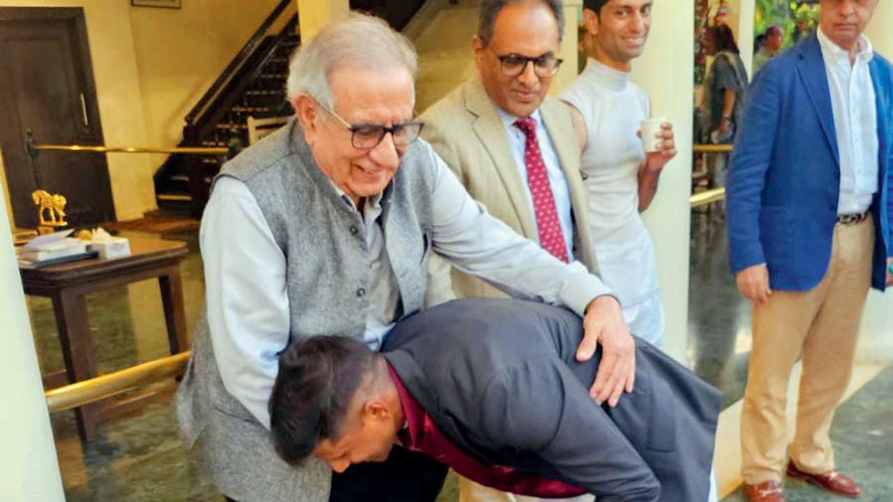 Sandesh bends to take Adil Gandhy’s blessings after the Derby win