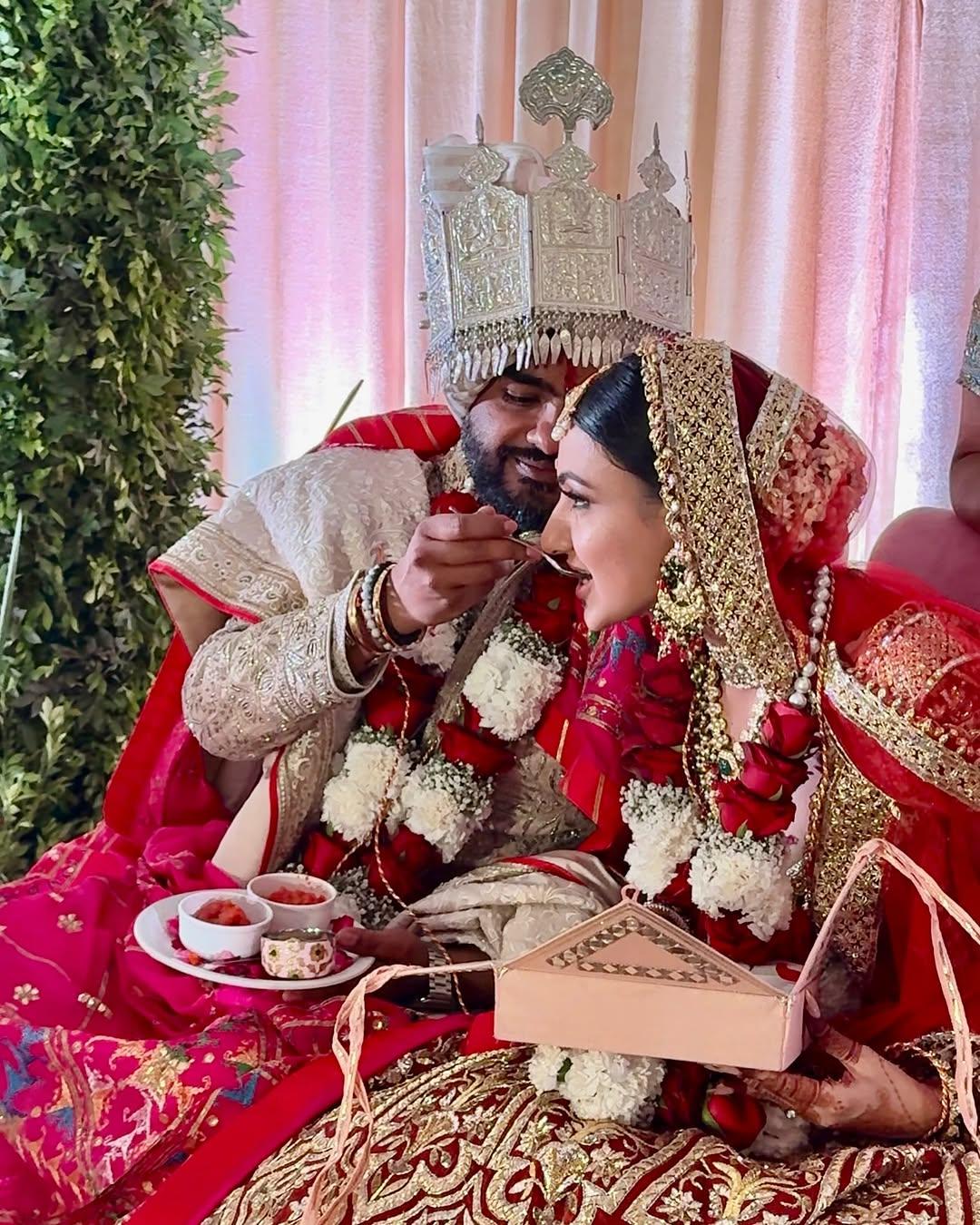 This picture shows the newlywed Siddharth feeding sweets to Neelam