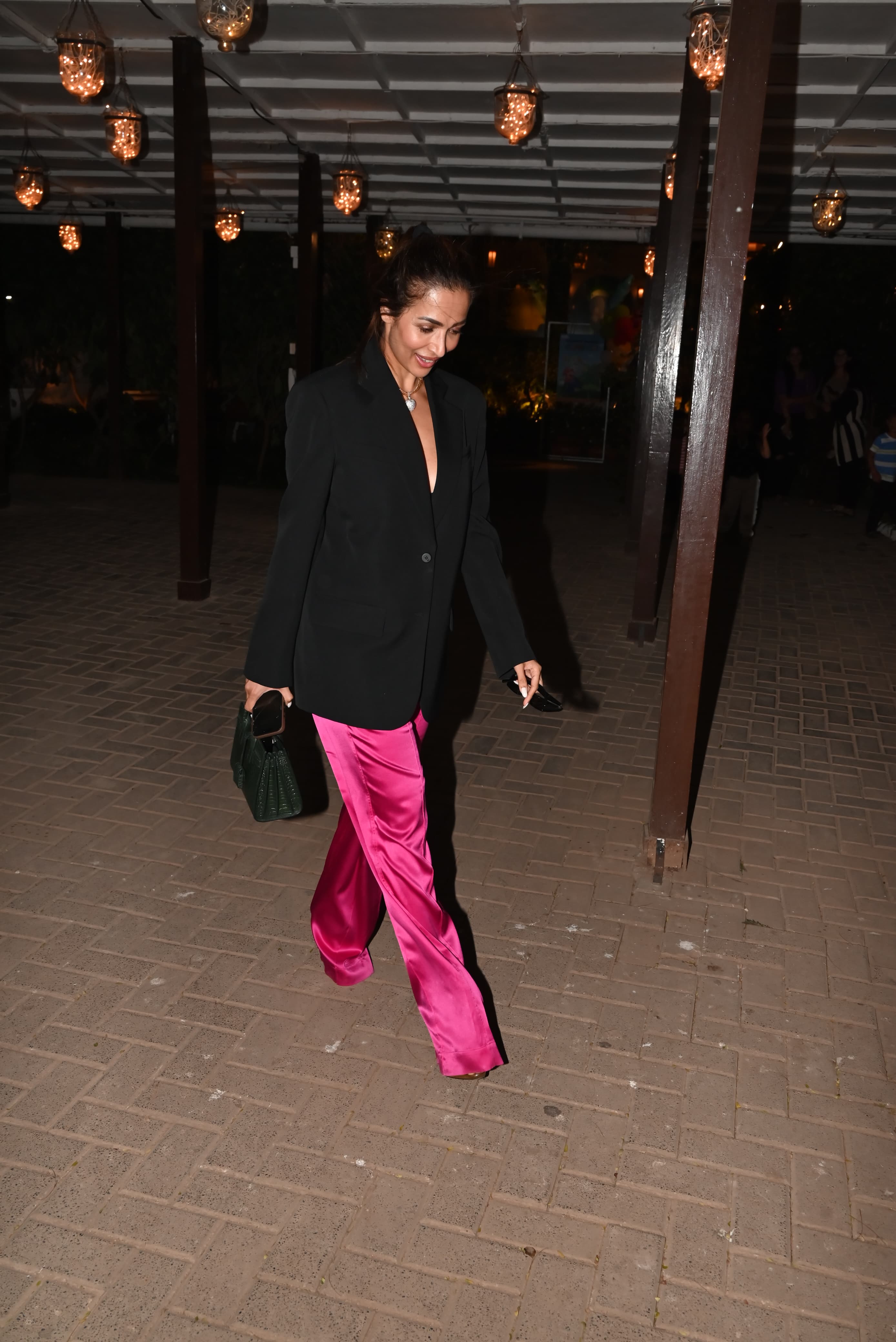 Malaika Arora was all smiles as she attended the birthday bash of Randhir Kapoor
