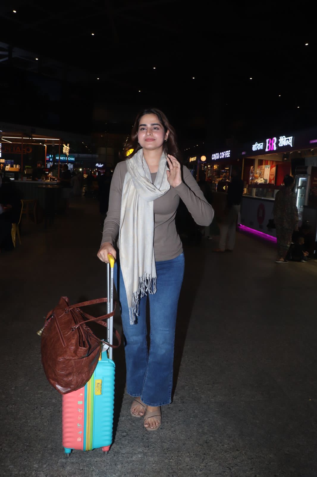 Ayesha Khan was spotted at Mumbai airport as she returned to the city