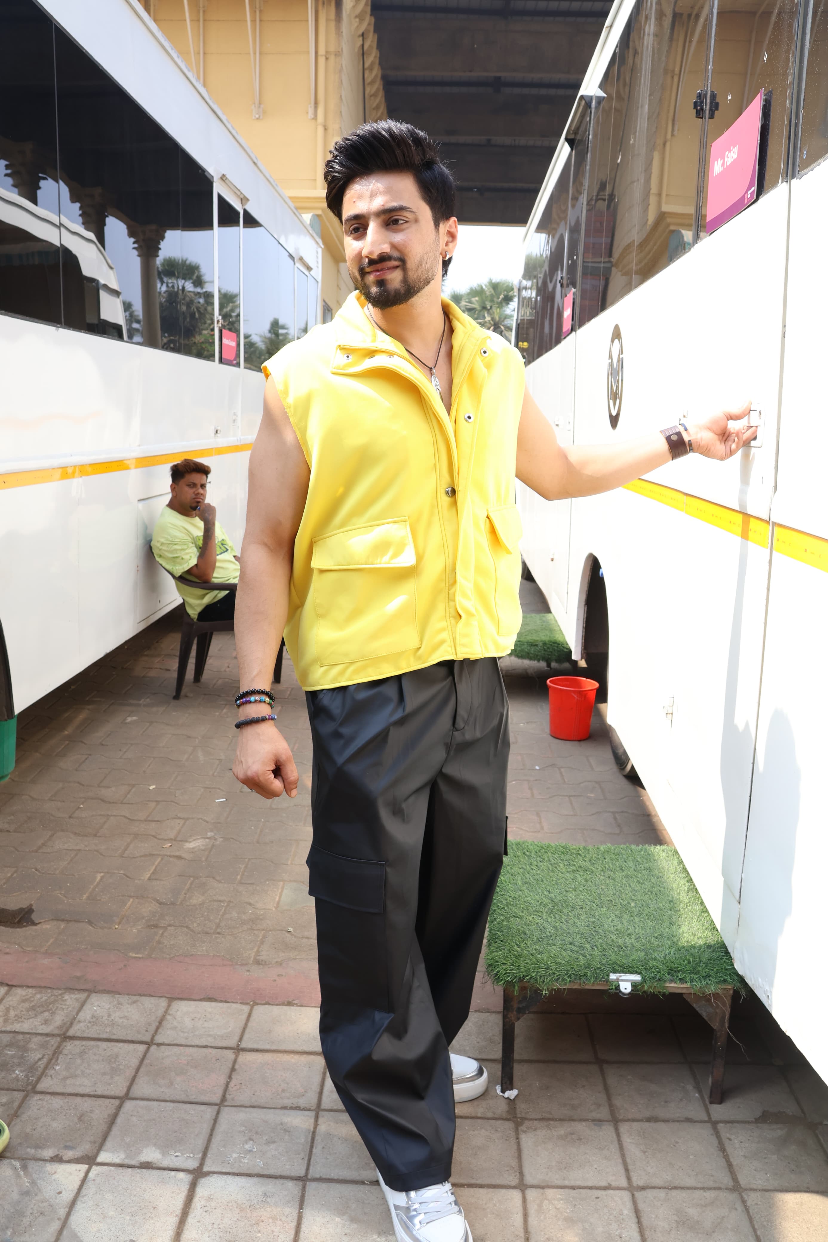 Faizu was clicked at the shoot location. The social media star wore a yellow jacket with loose pants