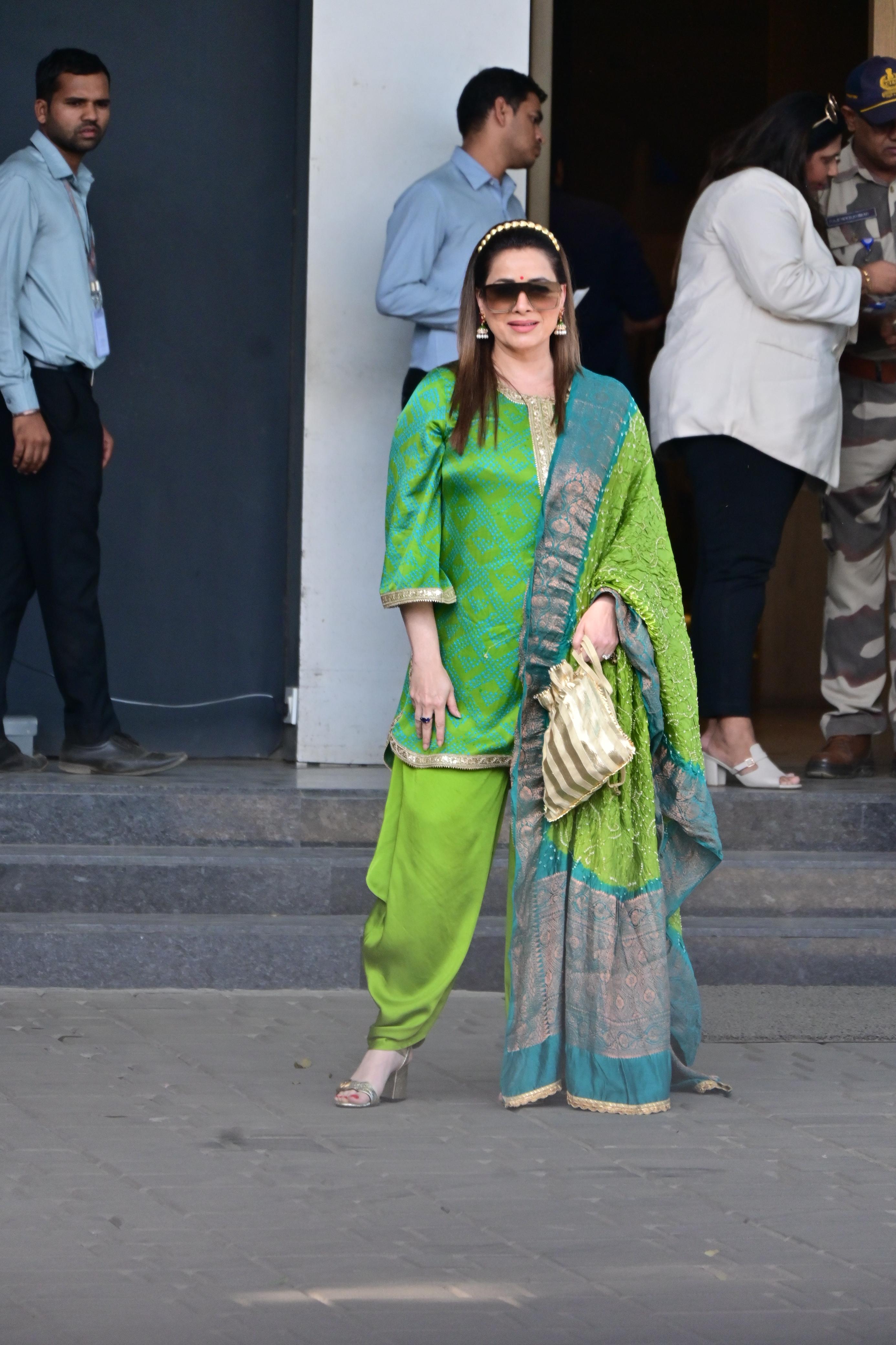 Neelam looked stunning in a beautiful green-on-green suit set as she jetted off from the city