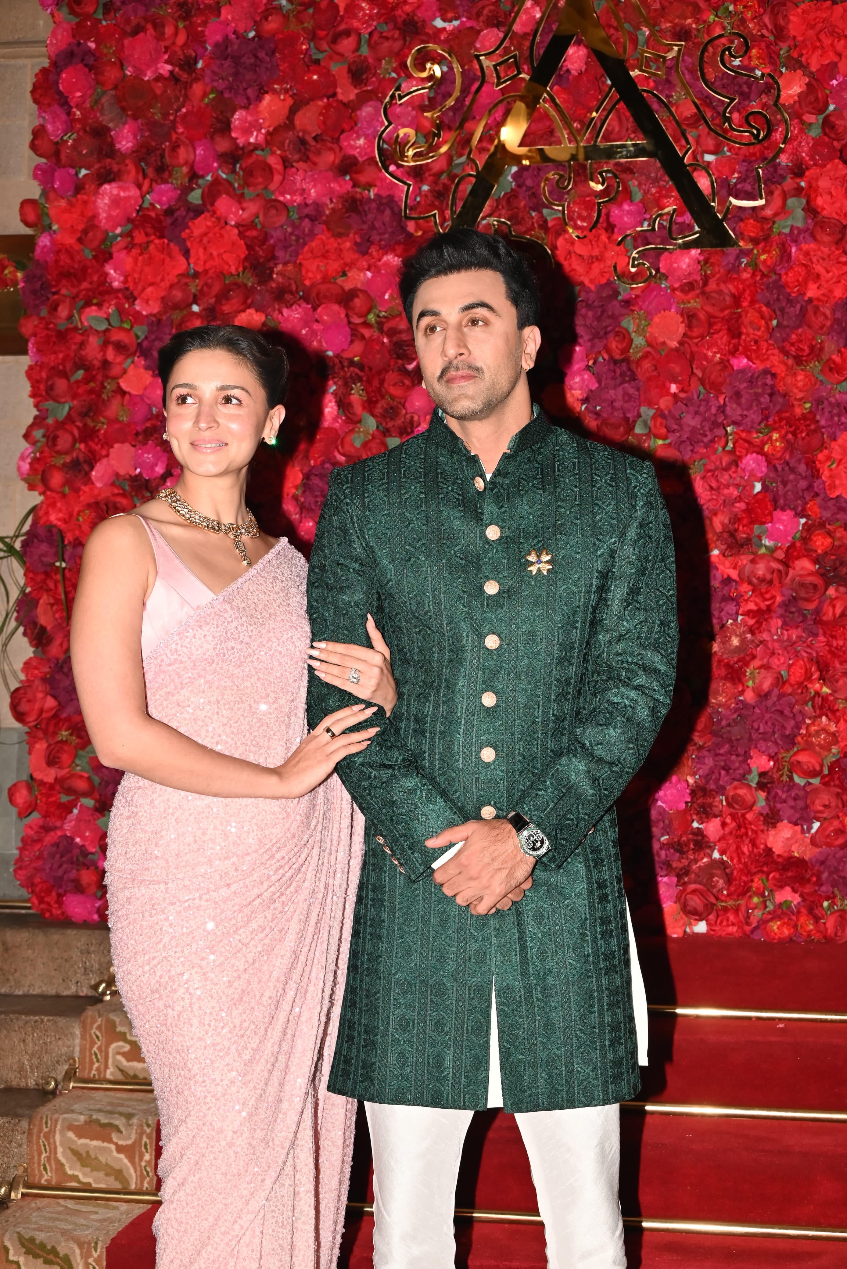 Alia Bhatt & Ranbir Kapoor arrived at Adar & Alekha's wedding ceremony. The actress looked stunning in a pink saree, while Ranbir slayed in a green bandh gala