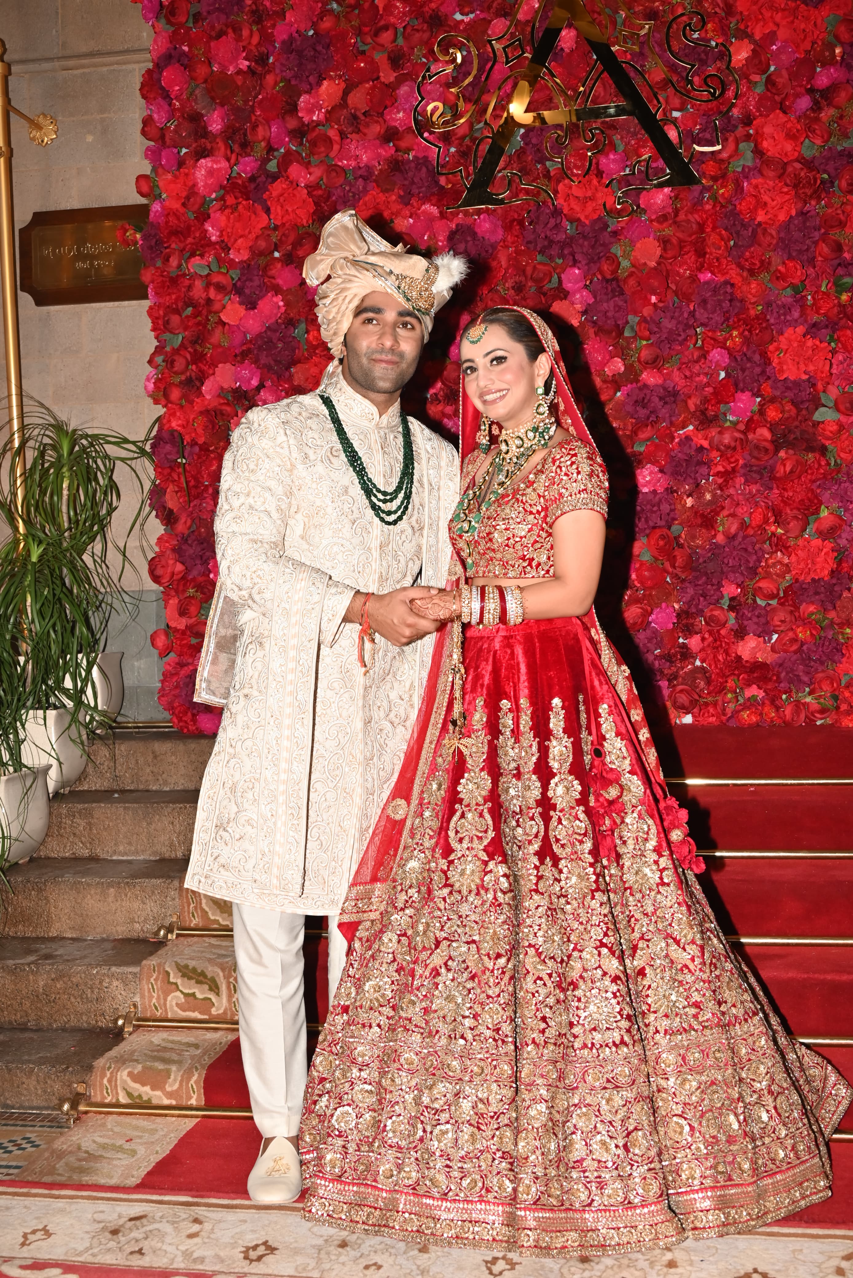 Aadar Jain and Alekha got married in a traditional ceremony. While Aadar was a stylish groom in a beautiful off-white sherwani with contrasting green accessories, Alekha looked stunning as a red bride