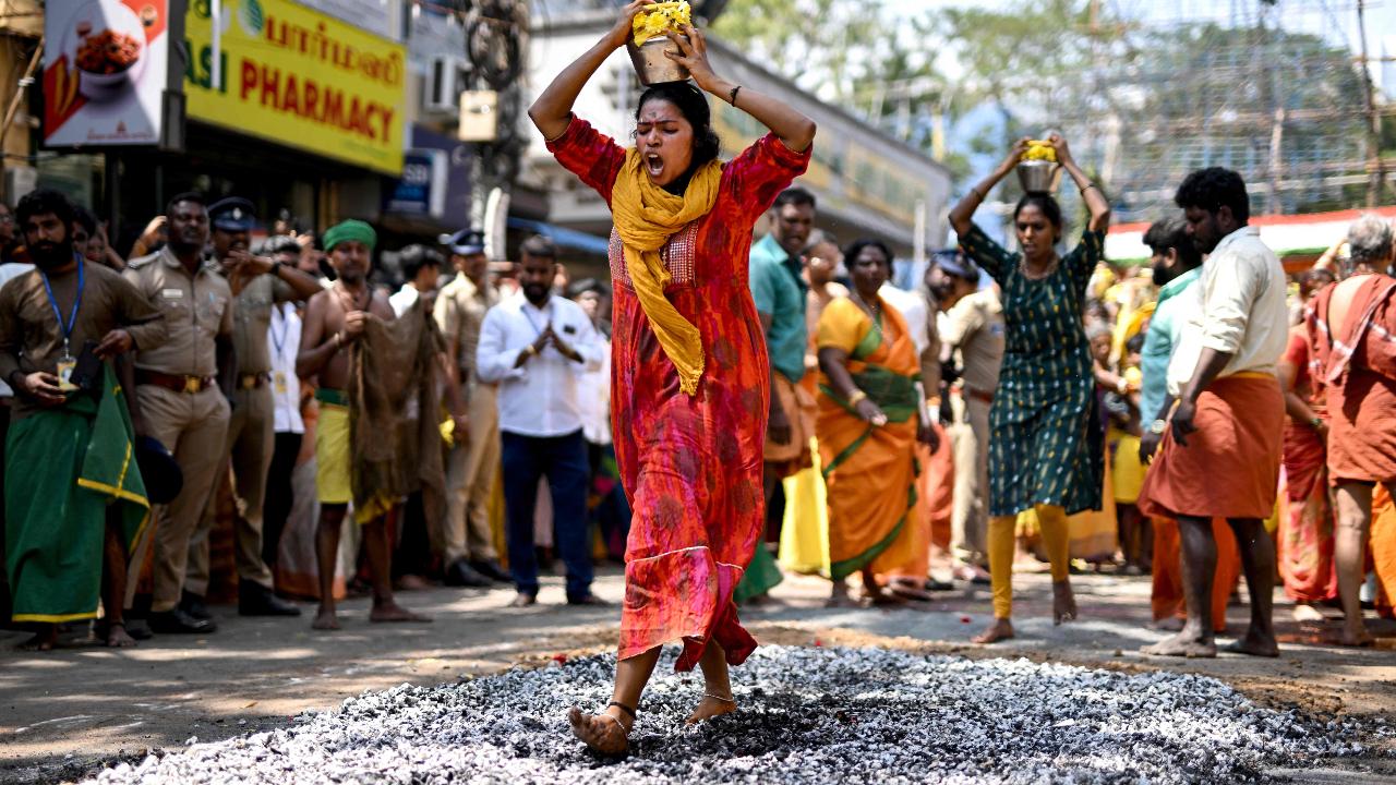 A Hindu devotee with metal rod piercings on his body, takes part in a procession during the Thaipusam festival in Chennai on February 11