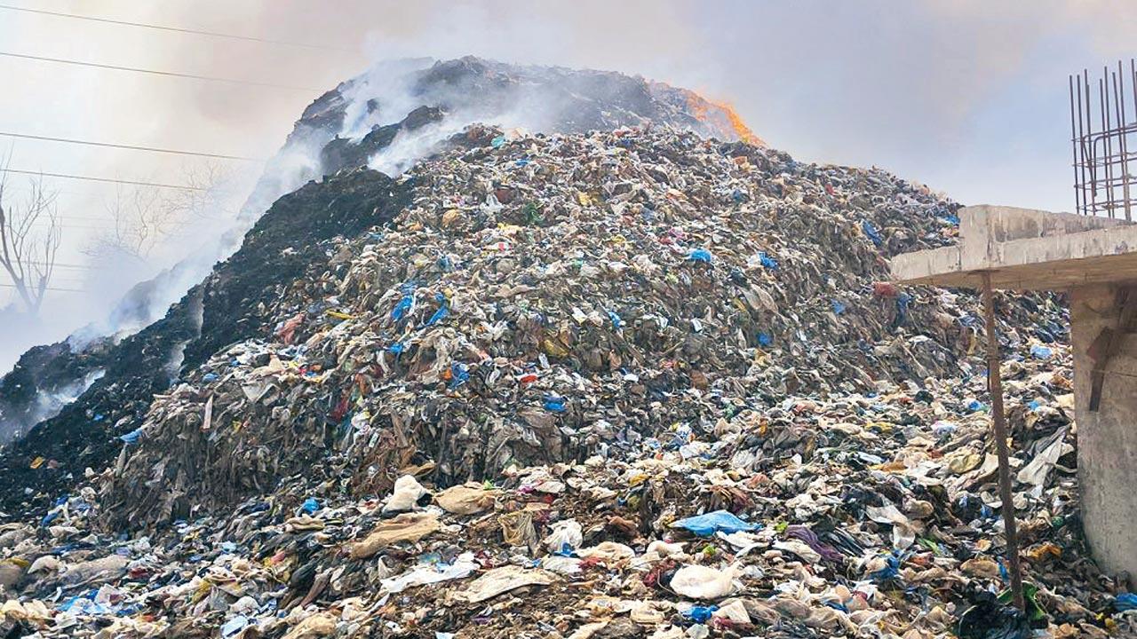 Mounds of trash in flames at the Bhandarli dumping ground on Friday