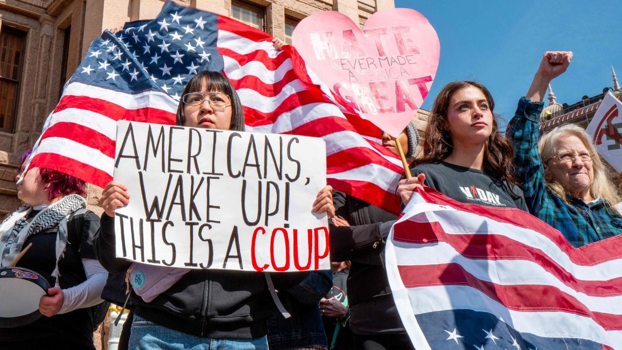 One sign at the rally that attracted hundreds in the nation's capital said, 