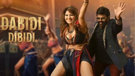 In yet another appearance in Dabidi Dibidi, Urvashi rocked a shiny deep-neck crop top with a thigh-high slit long skirt.