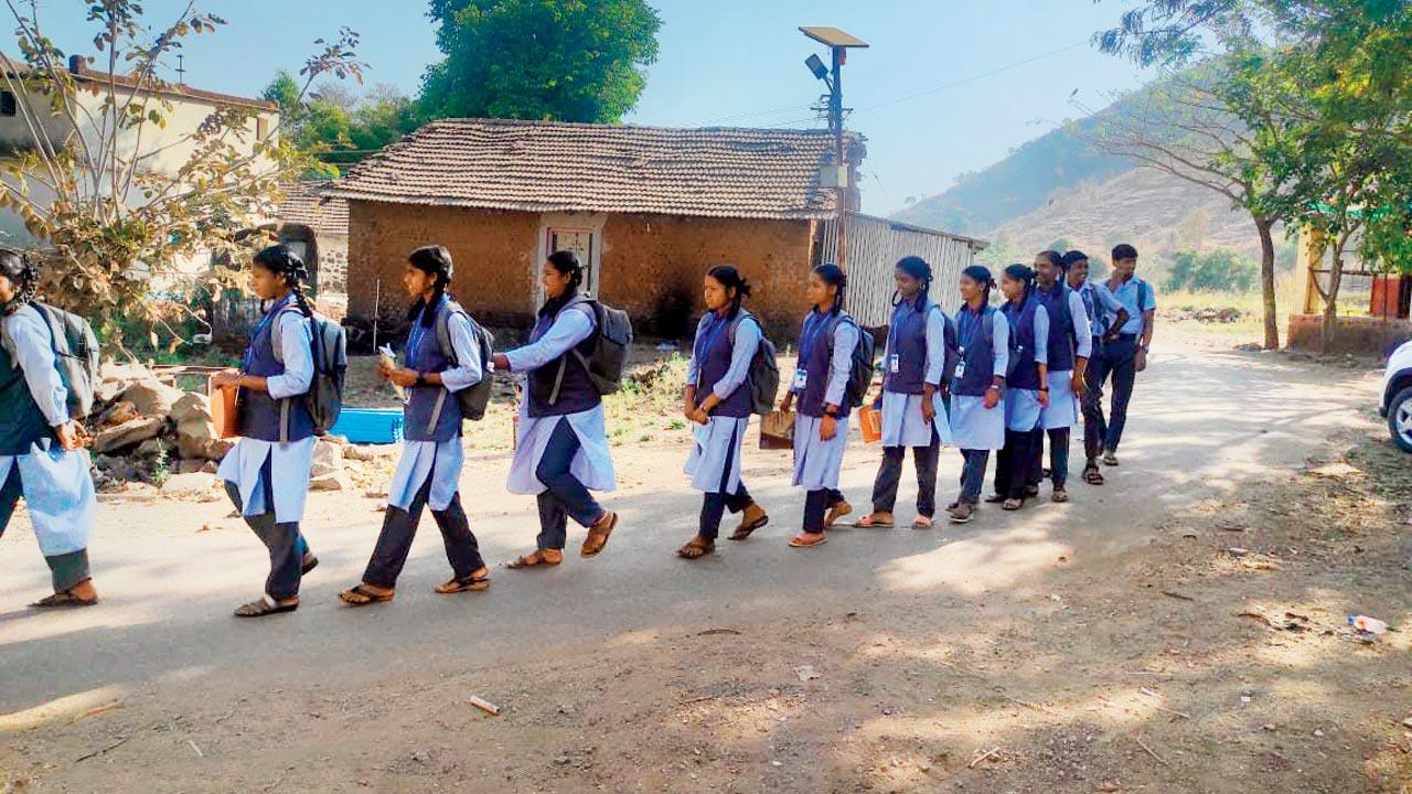 Students queue up to board the tempo for the exam centre