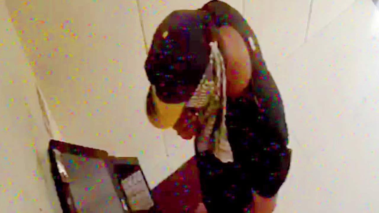 A screen grab of footage of the accused, Deepak Bulleten Bind, withdrawing money from an ATM