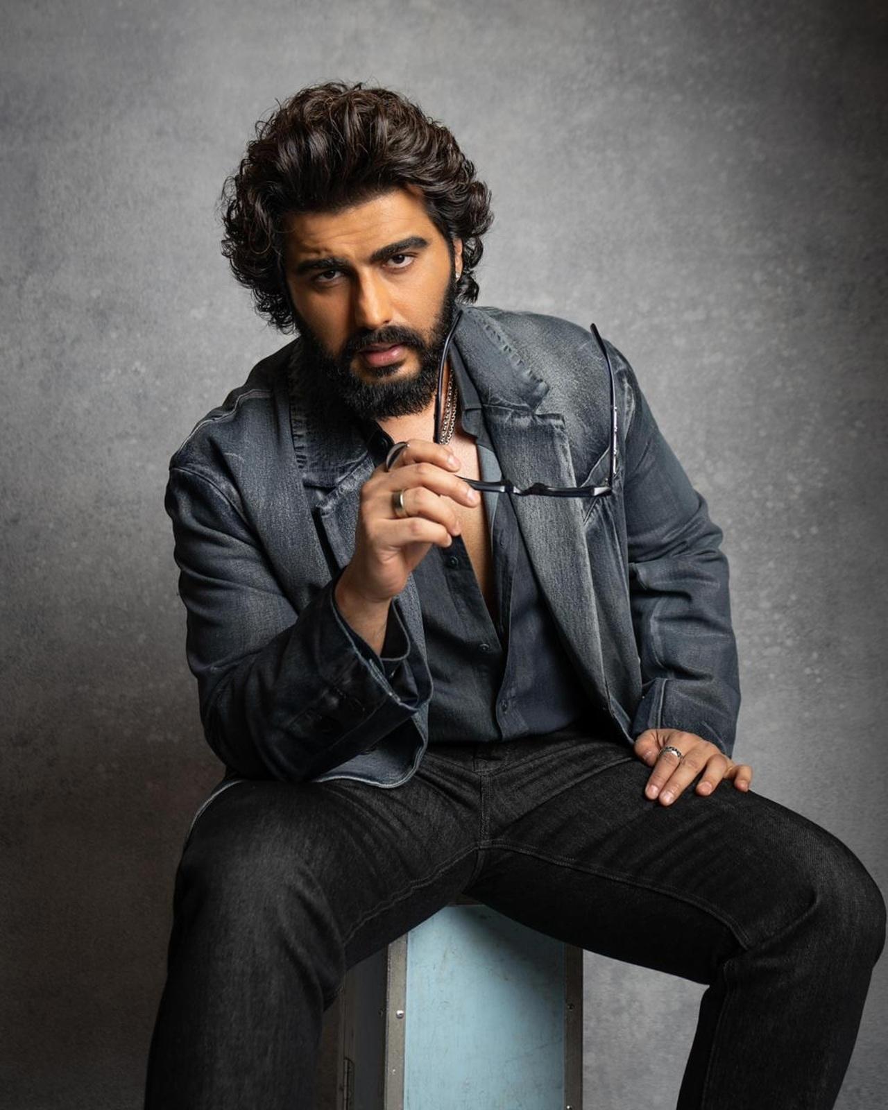 When not in the mood for something completely formal, Arjun layers with a bulky denim jacket