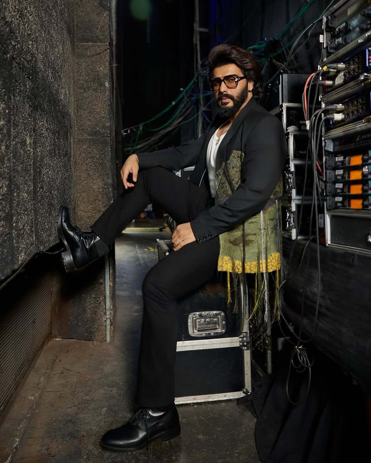 The actor shows how to add drama to a regular suit look