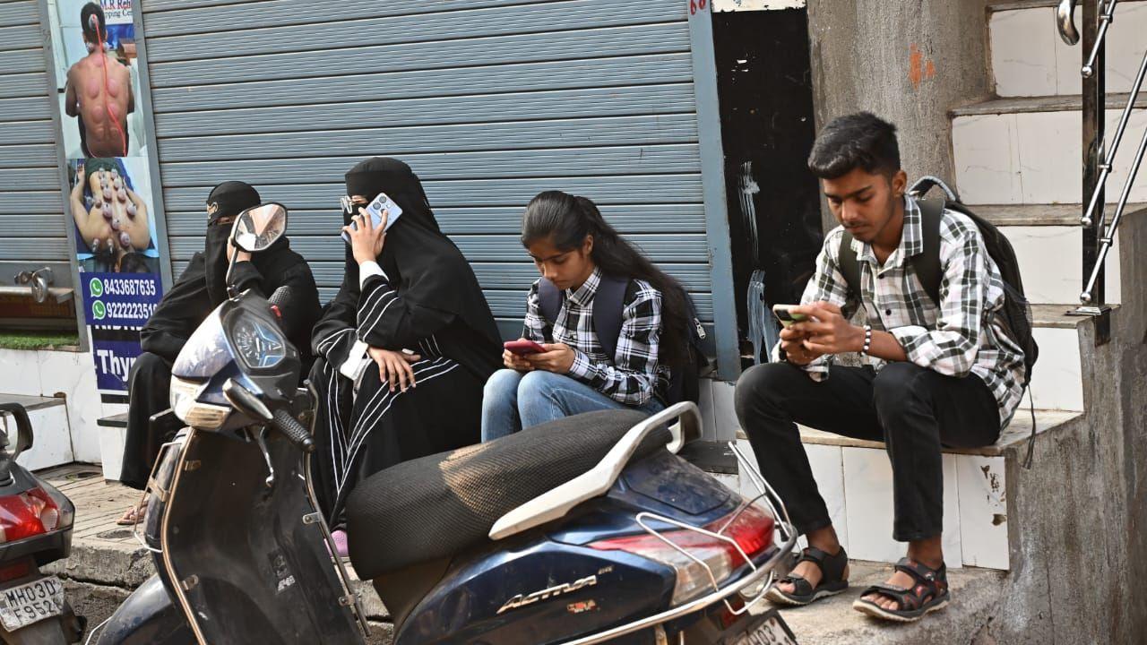 Authorities have also decided to deploy mobile and static squads at examination centres
(In Pic: Students wait outside Aisha English School and Junior College, Shivaji Nagar Govandi. Pic/Sameer Abedi)