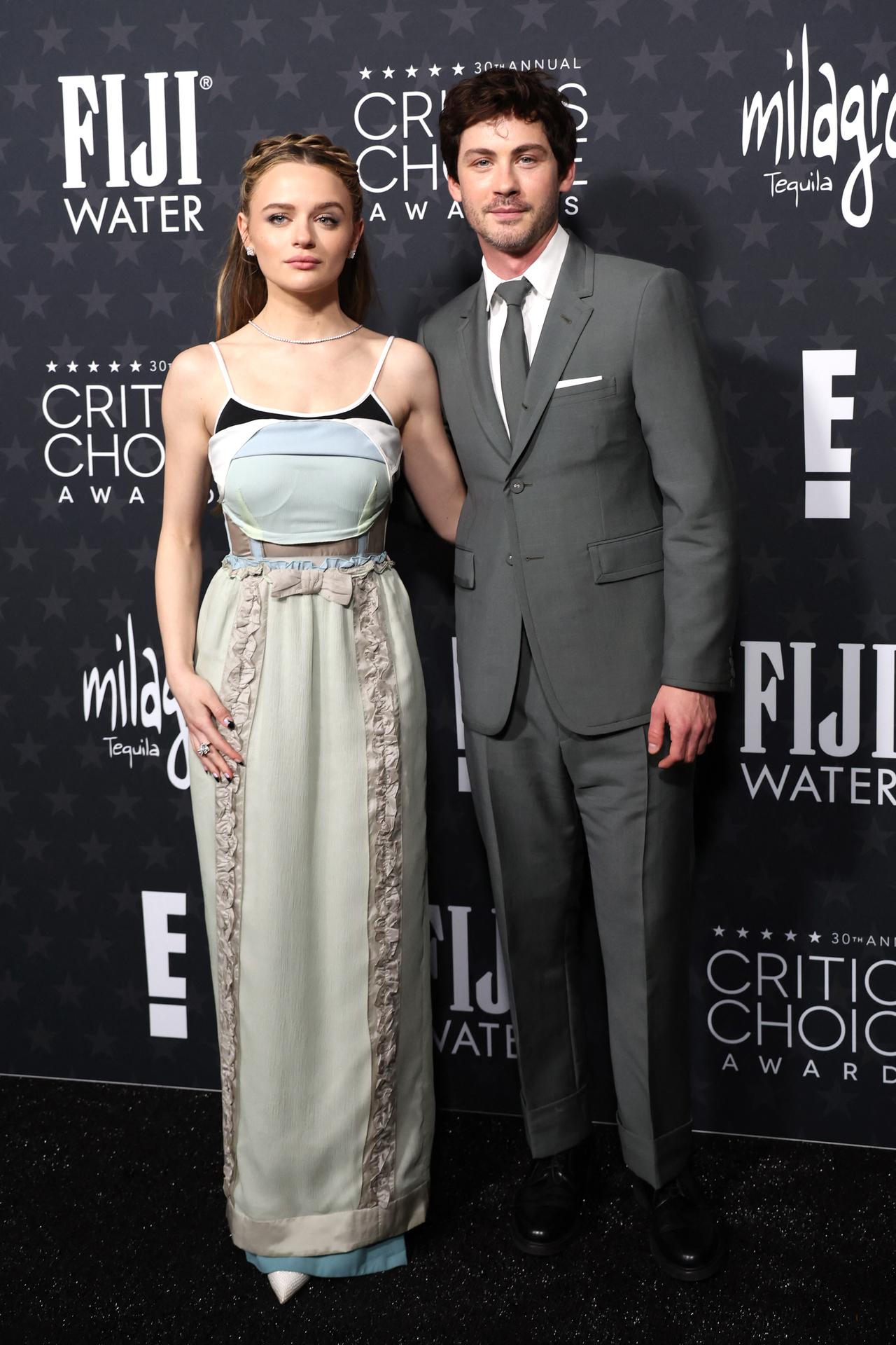 Actress Joey King poses with actor Logan Lerman on the red carpet
