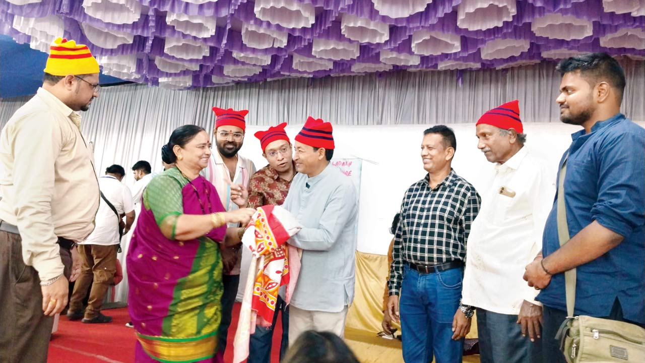 Members of the community greet Sonam Wangchuk with a traditional Koli surka 